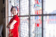 Little Cute Asian Girl Wearing Traditional Chinese Cheongsam Red With Paper Lanterns With The Chinese Alphabet Blessings Written On It Is A Fortune Blessing Compliment Decoration For Chinese New Year
