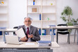 © Elnur - Old male employee working in the office