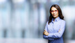 © vgstudio - Portrait of seriously looking businesswoman in eye glasses spectacles, indoors. Image of brunette young business woman, over blurred modern office interior background.