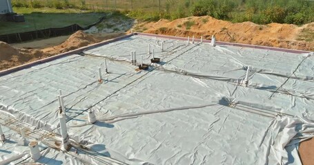 Wall Mural - Laying in the a trench ground PVC pipes before pouring concrete