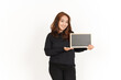 © Sino Images Studio - Showing, Presenting and holding Blank Blackboard Of Beautiful Asian Woman Wearing Black Shirt