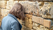 Jewish tourist prays in the wailing wall of Jerusalem, Israel