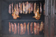 © Tatiana - Smoking meat and chicken in a wood-fired oven. Meat delicacies.