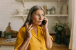 © shurkin_son - Senior female discussing something on smartphone and use gestures. Emotional mobile talk to solve work problem. Communication, remote job, technology, businesswoman concept