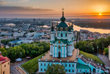 Fototapeta Miasto - Aerial view of St. Andrew's Church during dawn, one of the most famous sights of the city of Kiev. Cityscape concept, tourism, vacation, travel