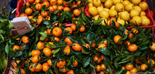 Fresh Mandarin Oranges Fruit Or Tangerines With Leaves On The Counter. Chinese New Year Tangerine In China Town.