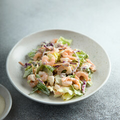 Wall Mural - Green salad with shrimps and mayo dressing