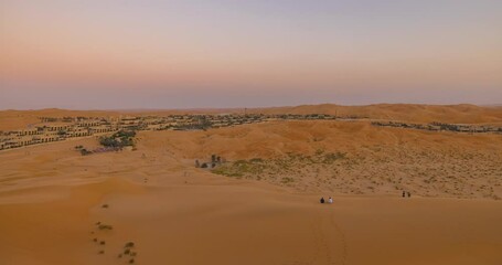 Wall Mural - Tourists in the Empty Quarter (Rub' al Khali) desert area of Abu Dhabi, United Arab Emirates