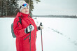 © Zuev Ali - An elderly woman goes in for sports. Nordic walking in winter.