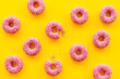 Pink glazed donutes background - set of donuts with icing