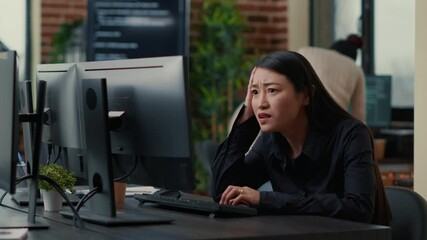 Cyber security programer focused on writing code encounters system failure while parsing algorithm sitting at desk. System engineer having unexpected compiling error while creating software.