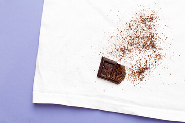 Wall Mural - white clothes with ditry stains from chocolate on purple very peri background