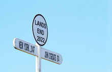 Signpost At Land`s End Cornwall UK. Land's End To John O' Groats Is The Traversal Of The Whole Length Of The Great Britain Between Two Extremities (southwest & Northeast). Cyclists & Runners.