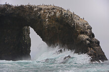 Storm Waves Hit Rock Arch At Anacapa Island, CA, USA