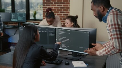 Wall Mural - mixed programers team working on group project on multiple screens showing running code in it startu