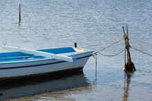 Authentic Small Blue Fishing Boat In Shallow Water From Nin, Croatia