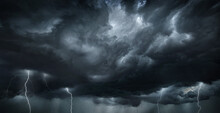 Thunderous Dark Sky With Black Clouds And Flashing Lightning. Panoramic View. Concept On The Theme Of Weather, Natural Disasters, Storms, Typhoons, Tornadoes, Thunderstorms, Lightning, Lightning.