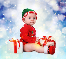 Poster - Cute little baby wearing Santa's elf clothes with Christmas gifts on color background