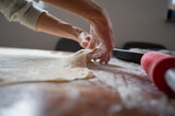 Fototapeta Kamienie - Stretching homemade pastry dough