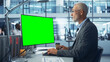 © Gorodenkoff - Diverse Modern Office: Senior Caucasian IT Technician Using Desktop Computer with Green Chroma Key Screen. Engineer Administrator Work on e-Commerce Development, Project Marketing, Big Data Analysis