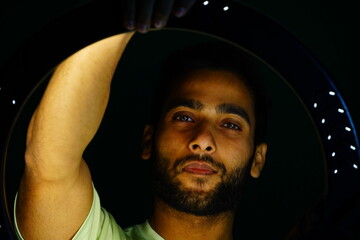 Wall Mural - man posing in front of the ring light