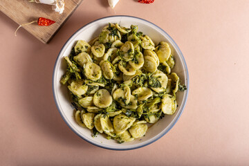 Wall Mural - Fresh orecchiette with turnip greens. Typical dish of Puglia, southern Italy. Suitable for those who follow a vegetarian diet