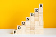 the word founder is written on a wooden cubes, concept