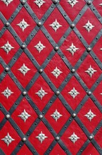 Medieval Red Door With Diagonal Iron Stripes And Silver Stars