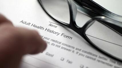 Canvas Print - Finger tapping on health history form