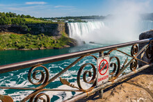 A Danger Do Not Climb Sign On The Railing At The Edge Of The Gorge In Niagara Falls Ontario Canada.