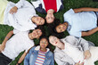 © EFStock - Relaxed teenager friends lying together on green grass with eyes closed, dreaming and sleeping