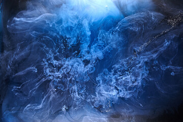 Wall Mural - Blue smoke on black ink background, colorful fog, abstract swirling ocean sea, acrylic paint pigment underwater
