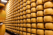 Process of making parmigiano-reggiano parmesan cheese on small cheese farm in Parma, Italy, factory maturation room for aging of cheese wheels up to 5 years