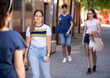 © JackF - Portrait of pensive teenage girl strolling through modern city streets in sunny day