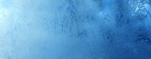 Winter Frosty Blue Patterns On The Glass Panoramic Banner. Icy, Frosty Pattern On The Window Glass. Background For Christmas And New Year. Macro Close Up