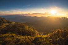 Sunset Over The Mountain Range With Colorful Sky And Amazing Landscape On Doi Langka Luang 2,031 Metres (6,660 Ft) At Khun Chae National Park Locate In Amper. Wiangpapao , Chaingrai District Thailand.