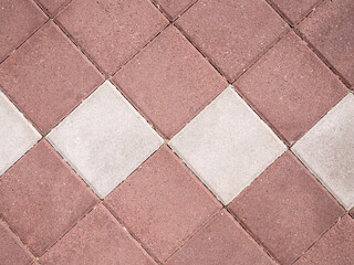 Paving stone background on city street. Mosaic modern pavement background texture close up.