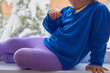 © retbool - child sitting on the windowsill,little girl in tights sitting and looking out the window in winter