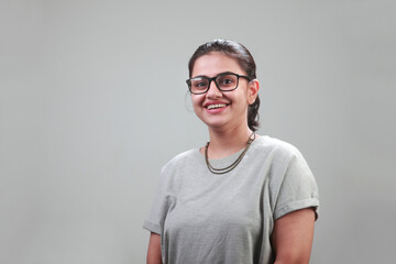 Wall Mural - Portrait of a happy young woman with a smiling face 