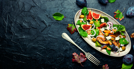 Wall Mural - Autumn seasonal salad with plums and figs