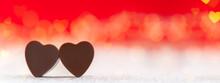 Heart Shaped Chocolates On Red Background With Boke. Happy Valentine's Day Greeting Card. Banner