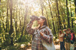 © standret - Discovering new places. Kids in green forest at summer daytime together