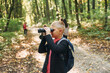 © standret - Discovering new places. Kids in green forest at summer daytime together