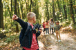 © standret - Founding the way. Kids in green forest at summer daytime together