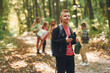 © standret - Having a walk. Kids in green forest at summer daytime together