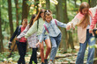 © standret - Walking on the new path. Kids in green forest at summer daytime together