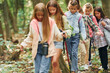 © standret - Walking on the new path. Kids in green forest at summer daytime together