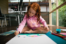 Young Girl Painting A Picture