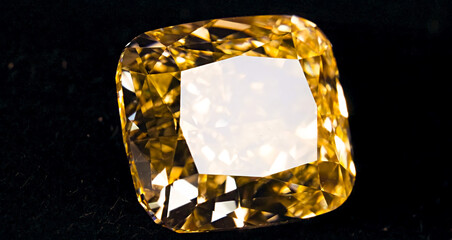 Closeup of Fancy Yellow Diamond isolated on black background stock image