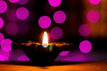 Clay oil lamps or diyas lit on Diwali